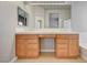 Bathroom featuring double sinks, bright lighting and lots of storage space for toiletries at 9137 Big Plantation Ave, Las Vegas, NV 89143