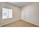 Light filled bedroom with plush carpet and a large window provides ample natural light at 9137 Big Plantation Ave, Las Vegas, NV 89143