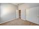 Bright bedroom with closet, neutral tones, and plush carpeting at 9137 Big Plantation Ave, Las Vegas, NV 89143