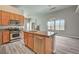 Open-concept kitchen with island, stainless steel appliances, and a seamless flow to the living area at 9137 Big Plantation Ave, Las Vegas, NV 89143