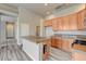 Open kitchen with granite counters, a center island, and modern appliances at 9137 Big Plantation Ave, Las Vegas, NV 89143