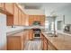 Open-concept kitchen featuring stainless steel appliances, granite countertops, and eat-in bar at 9137 Big Plantation Ave, Las Vegas, NV 89143