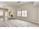 Open living room with fireplace, recessed lighting, and vinyl plank flooring at 9137 Big Plantation Ave, Las Vegas, NV 89143