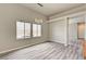 Bright open-concept living area with lots of light, plank flooring and modern pendant lighting at 9137 Big Plantation Ave, Las Vegas, NV 89143