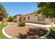 Well-maintained backyard with mature landscaping and patio at 9282 W Viking Rd, Las Vegas, NV 89147