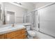 Bathroom with modern white tile featuring a shower over tub combo, and a single sink vanity at 9282 W Viking Rd, Las Vegas, NV 89147