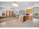 Open concept kitchen features white countertops and a view of the living area at 9282 W Viking Rd, Las Vegas, NV 89147