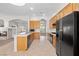 Bright kitchen featuring wood cabinets, black appliances, and white countertops at 9282 W Viking Rd, Las Vegas, NV 89147