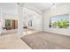 Bright living room featuring an open floor plan and large windows at 9282 W Viking Rd, Las Vegas, NV 89147