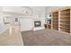 Bright living room featuring a fireplace and built-in bookshelves at 9282 W Viking Rd, Las Vegas, NV 89147