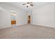 Large main bedroom with neutral carpeting and easy access to the bathroom at 9282 W Viking Rd, Las Vegas, NV 89147