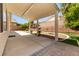 View of the covered patio showing the desert landscaping and textured concrete slab at 9282 W Viking Rd, Las Vegas, NV 89147