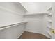 Bright walk-in closet with built-in shelves and rod for ample storage, complete with carpeted flooring at 9282 W Viking Rd, Las Vegas, NV 89147