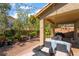 Backyard featuring a covered patio with outdoor furniture, landscaping, and privacy fence at 9513 Perennial View Ave, Las Vegas, NV 89148