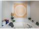 Inviting soaking tub with decorative wall art and tile surround at 9513 Perennial View Ave, Las Vegas, NV 89148