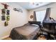 Bedroom with a desk, a ceiling fan, and a comfortable bed at 9513 Perennial View Ave, Las Vegas, NV 89148