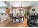 Cozy dining area adjacent to the kitchen, featuring tile floors and a view of the backyard at 9513 Perennial View Ave, Las Vegas, NV 89148