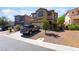 Charming two-story home with desert landscaping, a concrete driveway, and a well-maintained exterior at 9513 Perennial View Ave, Las Vegas, NV 89148