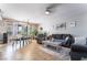 Inviting living room featuring tile floors, a dining area, neutral decor, and plenty of natural light at 9513 Perennial View Ave, Las Vegas, NV 89148