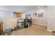 Loft area featuring neutral walls, carpet, storage containers and small writing desk at 9513 Perennial View Ave, Las Vegas, NV 89148