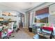 Bright office with carpet, large window, desk, storage and organizers at 9513 Perennial View Ave, Las Vegas, NV 89148