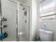Modern tiled shower with glass doors and updated fixtures at 9513 Perennial View Ave, Las Vegas, NV 89148