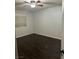 This bedroom features hardwood floors, a ceiling fan, and a bright window at , Henderson, NV 89014