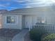 Inviting front entrance with white trimmed windows and trimmed bushes at , Henderson, NV 89014