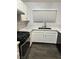 Modern kitchen features white cabinets, sleek appliances, and a stylish counter at , Henderson, NV 89014