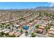 An aerial view showcasing the home nestled in a community with mountain views at 10301 Coal Creek Pl, Las Vegas, NV 89134