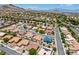Scenic aerial view of a home in a community against a stunning mountain backdrop at 10301 Coal Creek Pl, Las Vegas, NV 89134