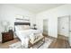 Inviting bedroom featuring a cozy bed, stylish decor, and access to a closet and bathroom at 10301 Coal Creek Pl, Las Vegas, NV 89134