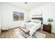 Bright bedroom with a comfortable bed, soft furnishings, and a large window providing natural light at 10301 Coal Creek Pl, Las Vegas, NV 89134