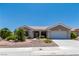 Charming single-story home featuring a well-maintained front yard with desert landscaping at 10301 Coal Creek Pl, Las Vegas, NV 89134