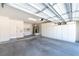 Spacious two-car garage with ample storage cabinets and utility connections at 10301 Coal Creek Pl, Las Vegas, NV 89134