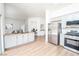 Open-concept kitchen with stainless steel appliances, a center island with breakfast bar, and views into the living spaces at 10301 Coal Creek Pl, Las Vegas, NV 89134