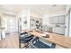 Modern kitchen with gray cabinets, stainless steel appliances, a breakfast bar, and an inviting open layout at 10301 Coal Creek Pl, Las Vegas, NV 89134