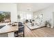 Bright living room featuring a plush sectional sofa, stylish decor, and natural light from a large window at 10301 Coal Creek Pl, Las Vegas, NV 89134