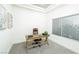 Office with a tray ceiling, wooden desk, natural light, and neutral decor at 10301 Coal Creek Pl, Las Vegas, NV 89134