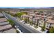 This aerial view showcases the two-story residential homes with solar panels in a residential area at 10519 Mann St, Las Vegas, NV 89141