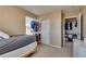 Relaxing bedroom features a ceiling fan, closet, and bright window at 10519 Mann St, Las Vegas, NV 89141