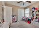 Comfortable bedroom with a closet and adjacent shelving at 10519 Mann St, Las Vegas, NV 89141