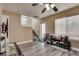 Versatile living space featuring vinyl plank floors and staircase access to the second floor at 10519 Mann St, Las Vegas, NV 89141