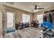 Bright bonus room features vinyl plank flooring and ample natural light from the windows at 10519 Mann St, Las Vegas, NV 89141