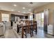Combined kitchen and dining area with a sliding door to the outside at 10519 Mann St, Las Vegas, NV 89141