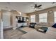 Open living space with a large TV and comfortable seating area at 10519 Mann St, Las Vegas, NV 89141