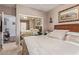 Bedroom with mirrored closet doors and wood-look headboard at 10832 Heritage Hills Dr, Las Vegas, NV 89134