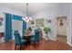 Elegant dining room with chandelier lighting and seating for four, perfect for intimate gatherings at 10832 Heritage Hills Dr, Las Vegas, NV 89134