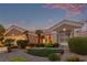 Attractive home displaying a well-maintained front yard with desert landscaping elements at 10832 Heritage Hills Dr, Las Vegas, NV 89134