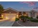 Charming single-story home featuring a two-car garage, desert landscaping, and a cozy front porch at 10832 Heritage Hills Dr, Las Vegas, NV 89134